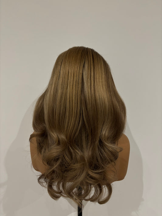 Mannequin head with styled blonde highlight wig in front of a white background