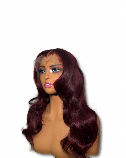 Mannequin head with burgundy wig on a white background