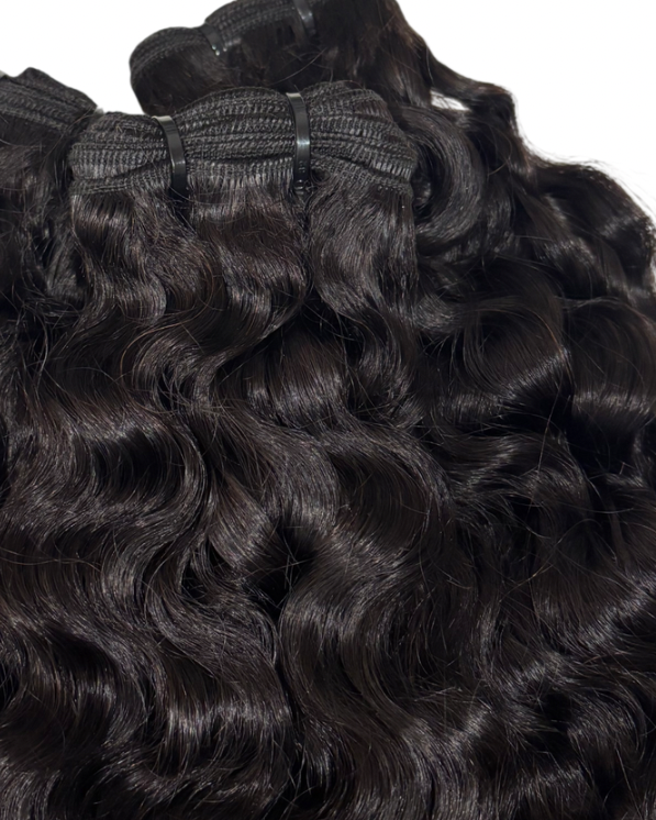 Natural 1B Burmese Curly bundles with a close-up view on a white background