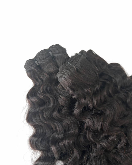 Burmese curly hair extensions on a white background